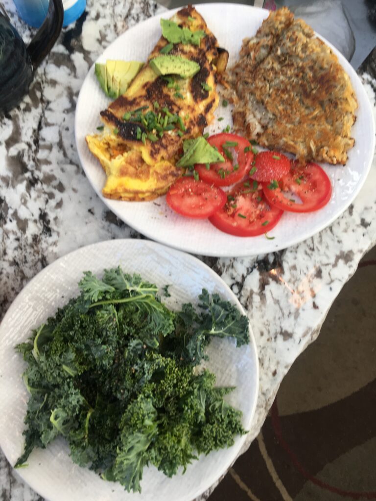 Veggie Omelet, tomatoes, kale, and hash browns
