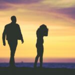 couple walking outside at sunset fighting constant criticism