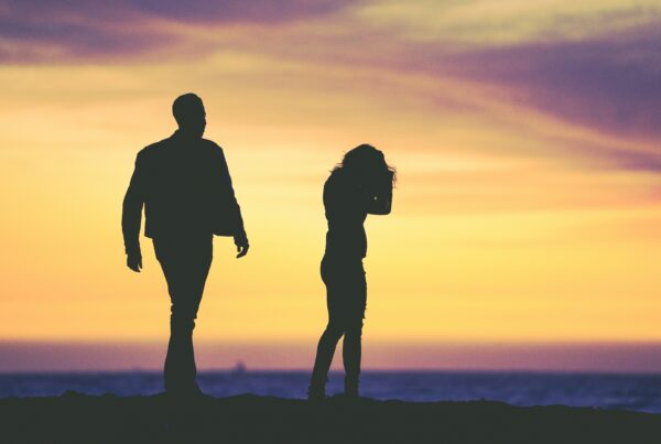 couple walking outside at sunset fighting constant criticism